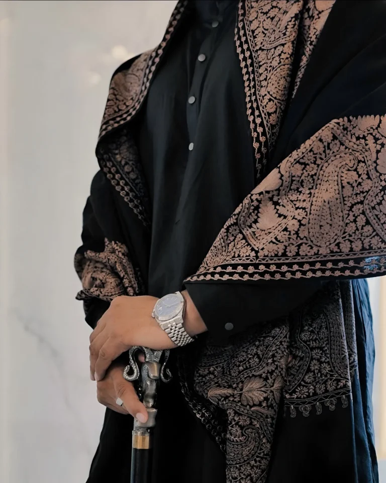 Embroidered shawl detail worn over a black Shalwar Kameez